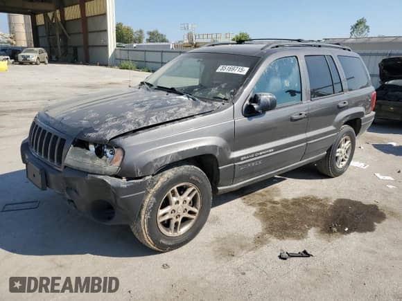 2004 Jeep Grand Cherokee Laredo with VIN 1J4GW48S84C348685, listed as a Copart auction lot 85169715 with 204,660 mi miles and Salvage title. Bid and sale history available at DreamBid. Image 1.