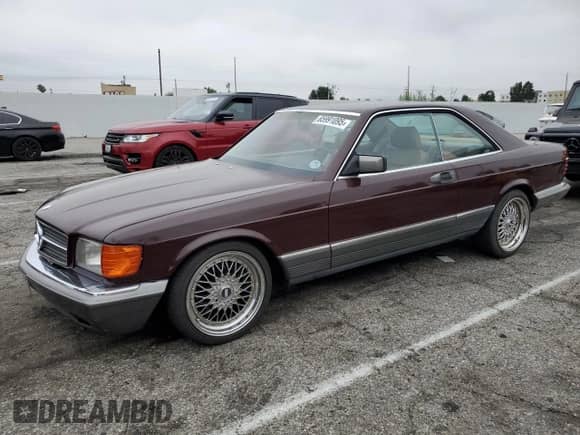 1983 Mercedes-Benz 380 SEC with VIN WDBCA43A3DB008043, listed as a Copart auction lot 65991095 with 146,606 mi miles and Salvage title. Bid and sale history available at DreamBid. Image 1.