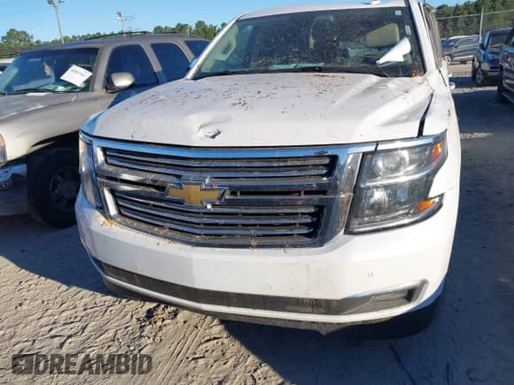 2019 Chevrolet Suburban Premier with VIN 1GNSCJKC0KR293658, listed as a IAAI auction lot 40563834 with 153,619 mi miles and . Bid and sale history available at DreamBid. Image 12.