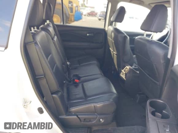 2018 Honda Pilot EX-L with VIN 5FNYF5H5XJB033220, listed as a IAAI auction lot 43205648 with 117,623 mi miles and . Bid and sale history available at DreamBid. Image 8.