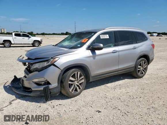 2018 Honda Pilot Touring с VIN 5FNYF5H94JB020448, выставлен на аукционе Copart как лот 65833715 с пробегом 146 320 миль миль и Списание • Salvage title. История ставок и продаж доступна на DreamBid. Изображение 1.