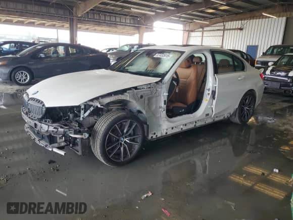 2019 BMW 3 Series 330i with VIN WBA5R1C54KAK12564, listed as a Copart auction lot 87452615 with 49,169 mi miles and Salvage title. Bid and sale history available at DreamBid. Image 1.