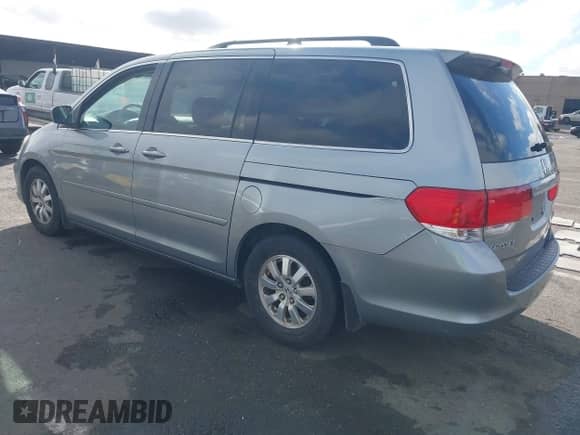 2008 Honda Odyssey EX-L with VIN 5FNRL38628B104477, listed as a IAAI auction lot 43363199 with 220,595 mi miles and . Bid and sale history available at DreamBid. Image 3.