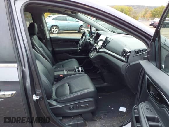 2022 Honda Odyssey Touring z VIN 5FNRL6H81NB028961, wystawiony jako IAAI lot #43456061 z przebiegiem 48 665 mil mil oraz . Historia ofert i sprzedaży dostępna na DreamBid. Obrazek 5.