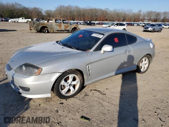 2006 Hyundai Tiburon GS с VIN KMHHM65D56U212346, выставлен на аукционе Copart как лот 87543845 с пробегом 181 605 миль миль и Чистый • Clean title. История ставок и продаж доступна на DreamBid. Изображение 1.