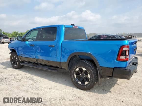 2024 Ram 1500 Rebel z VIN 1C6SRFLT2RN122227, wystawiony jako Copart lot #57086395 z przebiegiem 23 705 mil mil oraz Szkoda całkowita • Salvage title. Historia ofert i sprzedaży dostępna na DreamBid. Obrazek 2.