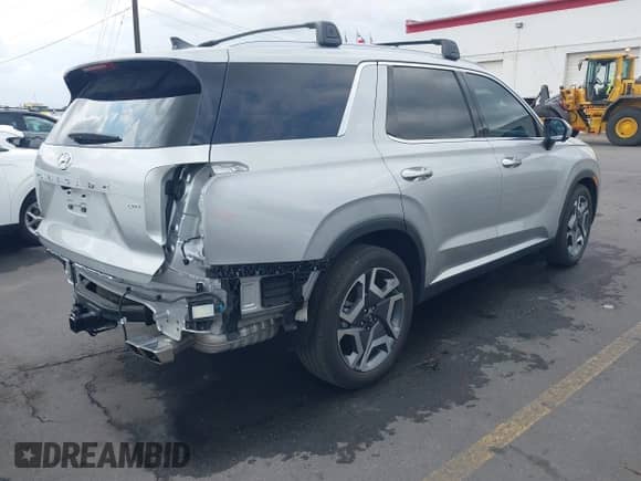 2024 Hyundai Palisade SEL z VIN KM8R4DGE6RU737001, wystawiony jako IAAI lot #43095820 z przebiegiem 8 980 mil mil oraz . Historia ofert i sprzedaży dostępna na DreamBid. Obrazek 4.