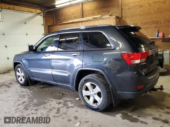 2012 Jeep Grand Cherokee Limited z VIN 1C4RJFBT4CC264632, wystawiony jako Copart lot #90137105 z przebiegiem 214 018 mil mil oraz Czysty tytuł • Clean title. Historia ofert i sprzedaży dostępna na DreamBid. Obrazek 2.