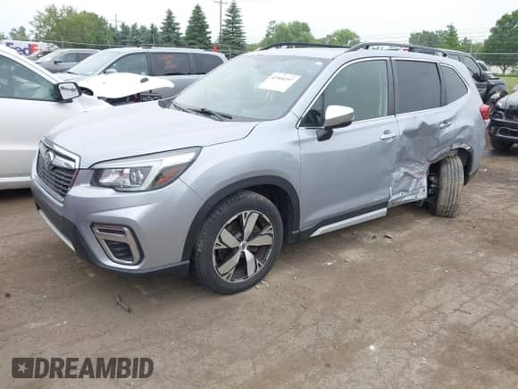2020 Subaru Forester Touring with VIN JF2SKAXCXLH494092, listed as a IAAI auction lot 42504297 with 83,051 mi miles and . Bid and sale history available at DreamBid. Image 17.
