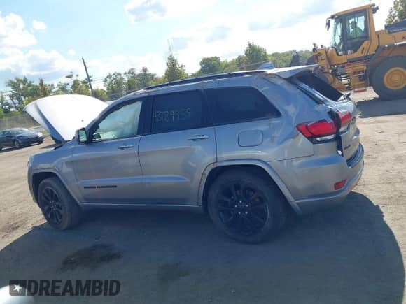 2019 Jeep Grand Cherokee Altitude with VIN 1C4RJFAG6KC594808, listed as a IAAI auction lot 43189959 with 104,257 mi miles and . Bid and sale history available at DreamBid. Image 15.