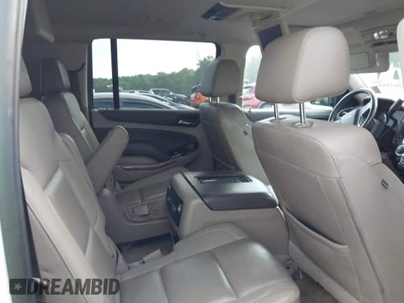 2019 Chevrolet Suburban Premier with VIN 1GNSCJKC9KR126778, listed as a IAAI auction lot 42675554 with 164,489 mi miles and . Bid and sale history available at DreamBid. Image 8.