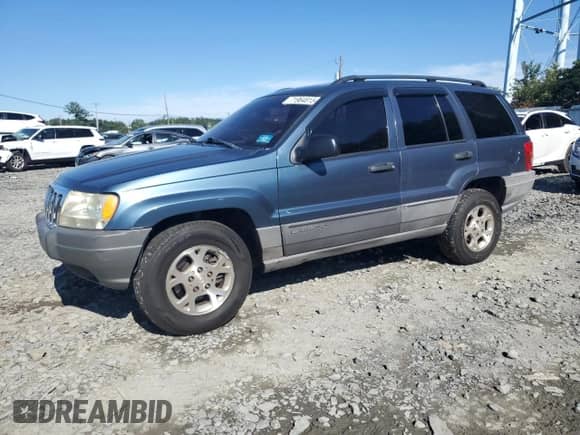 2002 Jeep Grand Cherokee Laredo with VIN 1J4GW48S42C251464, listed as a Copart auction lot 71964815 with 144,429 mi miles and Salvage title. Bid and sale history available at DreamBid. Image 1.