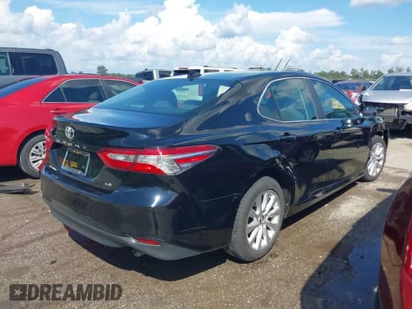 2020 Toyota Camry LE with VIN 4T1C11AKXLU877796, listed as a IAAI auction lot 43384594 with 78,546 mi miles and . Bid and sale history available at DreamBid. Image 4.