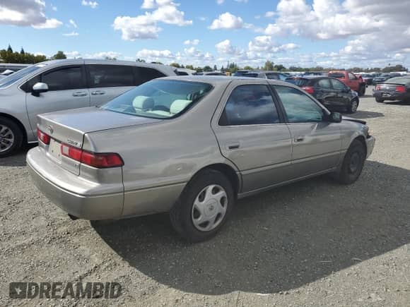 1997 Toyota Camry LE с VIN 4T1BF22K8VU037634, выставлен на аукционе Copart как лот 81998345 с пробегом 169 624 миль миль и Списание • Salvage title. История ставок и продаж доступна на DreamBid. Изображение 3.
