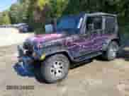 2000 Jeep Wrangler SE with VIN 1J4FA29P8YP784721, listed as a Copart auction lot 82079075 with 157,084 mi miles and Clean title. Bid and sale history available at DreamBid. Image 1.