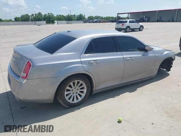 2013 Chrysler 300 with VIN 2C3CCAAG9DH727908, listed as a IAAI auction lot 42702399 with 105,987 mi miles and . Bid and sale history available at DreamBid. Image 4.