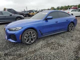 2024 BMW i4 eDrive40 with VIN WBY73AW04RFR49109, listed as a Copart auction lot 60988065 with 20,993 mi miles and Salvage title. Bid and sale history available at DreamBid. Image 1.