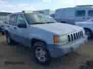 1996 Jeep Grand Cherokee Laredo z VIN 1J4GZ58S9TC245352, wystawiony jako IAAI lot #42860561 z przebiegiem Nie podano mil oraz . Historia ofert i sprzedaży dostępna na DreamBid. Obrazek 1.