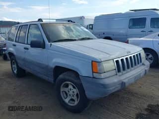 1996 Jeep Grand Cherokee Laredo z VIN 1J4GZ58S9TC245352, wystawiony jako IAAI lot #42860561 z przebiegiem Nie podano mil oraz . Historia ofert i sprzedaży dostępna na DreamBid. Obrazek 1.
