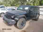 2022 Jeep Wrangler Unlimited Rubicon with VIN 1C4JJXR63NW228550, listed as a IAAI auction lot 41957313 with 15,860 mi miles and . Bid and sale history available at DreamBid. Image 2.