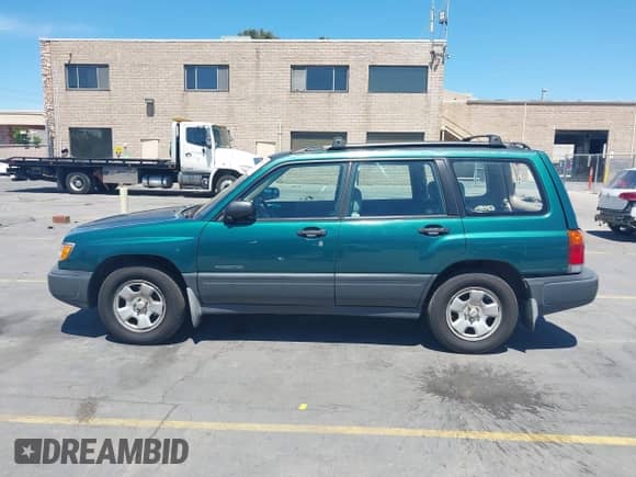 1999 Subaru Forester L with VIN JF1SF6353XG711250, listed as a IAAI auction lot 42805015 with 223,479 mi miles and . Bid and sale history available at DreamBid. Image 14.