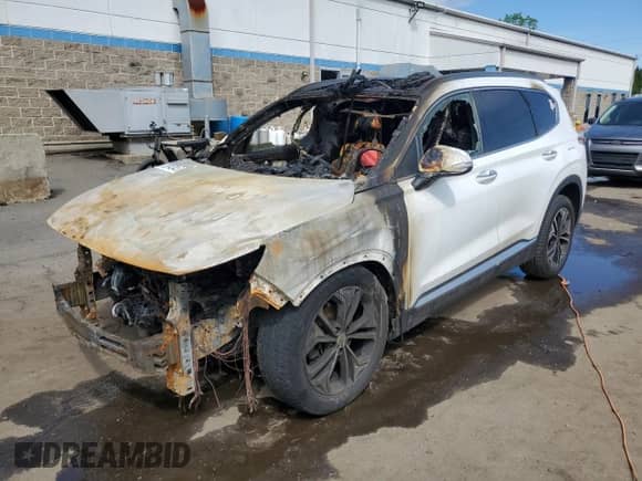 2019 Hyundai Santa Fe Ultimate с VIN 5NMS5CAA0KH068322, выставлен на аукционе Copart как лот 55943415 с пробегом Не указан миль и На запчасти • Non repairable. История ставок и продаж доступна на DreamBid. Изображение 1.
