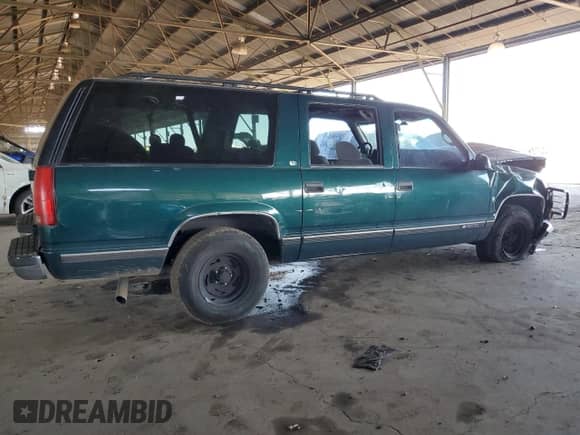 1997 Chevrolet Suburban z VIN 3GNEC16RXVG178307, wystawiony jako Copart lot #48878935 z przebiegiem 179 717 mil mil oraz Szkoda całkowita • Salvage title. Historia ofert i sprzedaży dostępna na DreamBid. Obrazek 3.