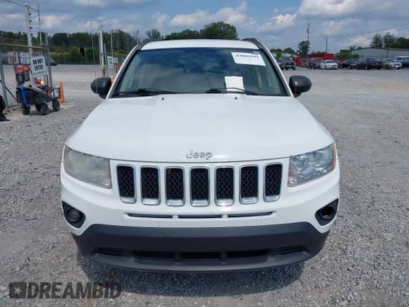 2012 Jeep Compass Sport z VIN 1C4NJDBBXCD608033, wystawiony jako IAAI lot #43069199 z przebiegiem 177 249 mil mil oraz . Historia ofert i sprzedaży dostępna na DreamBid. Obrazek 13.