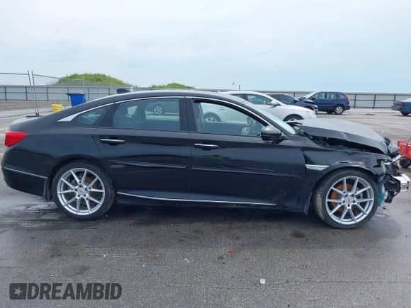 2018 Honda Accord Touring with VIN 1HGCV2F90JA007429, listed as a IAAI auction lot 42928546 with 53,984 mi miles and . Bid and sale history available at DreamBid. Image 14.