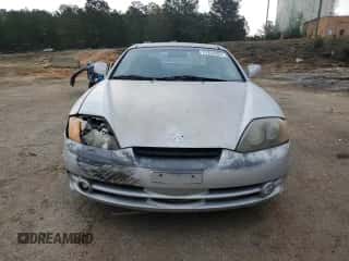 2003 Hyundai Tiburon GT с VIN KMHHN65F13U013420, выставлен на аукционе Copart как лот 51234495 с пробегом 230 612 миль миль и Списание • Salvage title. История ставок и продаж доступна на DreamBid. Изображение 5.