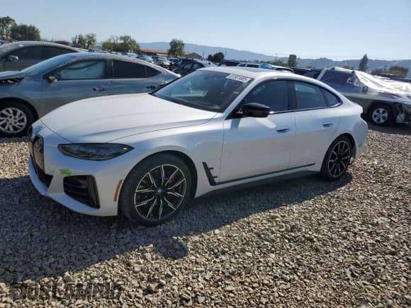 2023 BMW i4 eDrive40 with VIN WBY73AW0XPFP34797, listed as a Copart auction lot 81901885 with 16,966 mi miles and Salvage title. Bid and sale history available at DreamBid. Image 1.