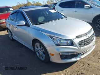 2015 Chevrolet Cruze LTZ z VIN 1G1PG5SB6F7287326, wystawiony jako IAAI lot #43479281 z przebiegiem 130 537 mil mil oraz . Historia ofert i sprzedaży dostępna na DreamBid. Obrazek 1.