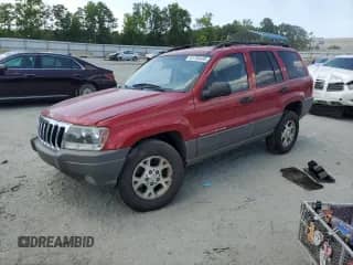 2002 Jeep Grand Cherokee Sport with VIN 1J4GW38S72C252344, listed as a Copart auction lot 61769485 with 306,152 mi miles and Salvage title. Bid and sale history available at DreamBid. Image 1.