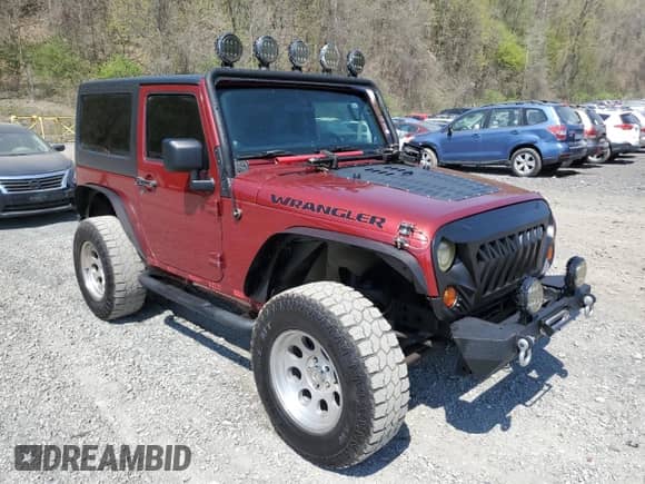 2012 Jeep Wrangler Sport with VIN 1C4AJWAG7CL105511, listed as a Copart auction lot 54671835 with 137,362 mi miles and Clean title. Bid and sale history available at DreamBid. Image 4.