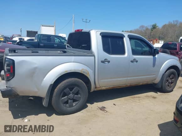 2011 Nissan Frontier Pro-4X z VIN 1N6AD0EVXBC407089, wystawiony jako IAAI lot #42113537 z przebiegiem 124 853 mil mil oraz . Historia ofert i sprzedaży dostępna na DreamBid. Obrazek 13.