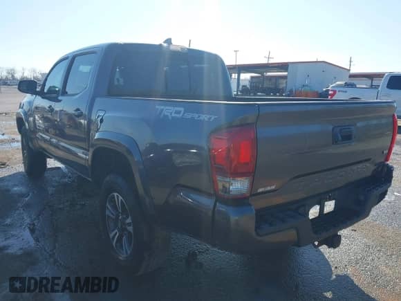 2017 Toyota Tacoma TRD Off Road with VIN 5TFAZ5CN2HX027623, listed as a IAAI auction lot 41731461 with 103,232 mi miles and . Bid and sale history available at DreamBid. Image 3.