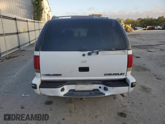 1999 Chevrolet Blazer LS z VIN 1GNCS13W1X2162495, wystawiony jako Copart lot #80019274 z przebiegiem Nie podano mil oraz Szkoda całkowita • Salvage title. Historia ofert i sprzedaży dostępna na DreamBid. Obrazek 6.