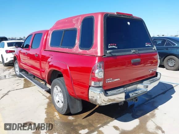 2014 Toyota Tacoma PreRunner with VIN 3TMKU4HN4EM041871, listed as a IAAI auction lot 41641763 with 148,968 mi miles and . Bid and sale history available at DreamBid. Image 3.