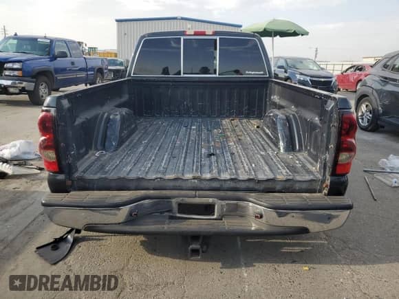 2005 Chevrolet Silverado 1500 Work Truck z VIN 1GCEC19V55Z327255, wystawiony jako Copart lot #71475115 z przebiegiem 211 799 mil mil oraz Szkoda całkowita • Salvage title. Historia ofert i sprzedaży dostępna na DreamBid. Obrazek 6.