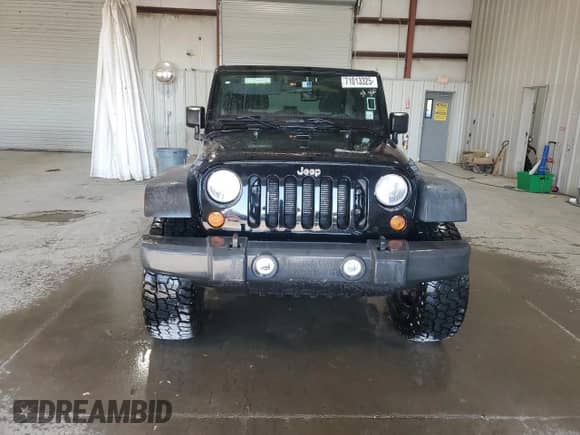 2012 Jeep Wrangler Sport with VIN 1C4AJWAG4CL215593, listed as a Copart auction lot 71013325 with 112,333 mi miles and Salvage title. Bid and sale history available at DreamBid. Image 5.