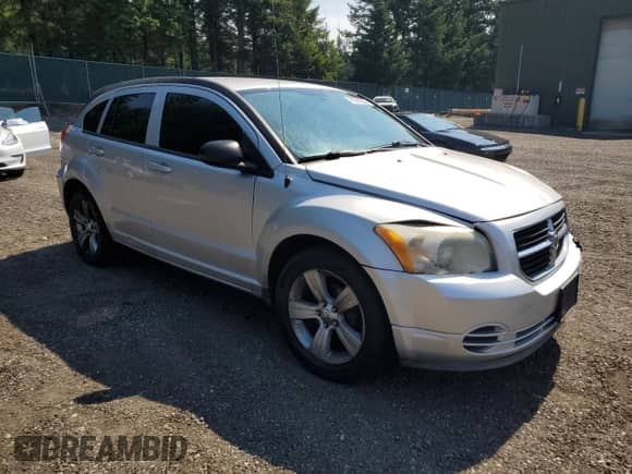 2010 Dodge Caliber SXT with VIN 1B3CB4HA5AD530259, listed as a Copart auction lot 70313555 with 184,173 mi miles and Salvage title. Bid and sale history available at DreamBid. Image 4.