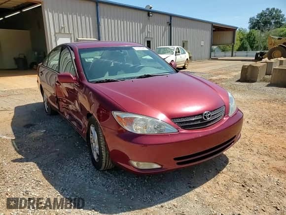 2003 Toyota Camry LE z VIN 4T1BE32K93U195373, wystawiony jako Copart lot #71675385 z przebiegiem 150 988 mil mil oraz Szkoda całkowita • Salvage title. Historia ofert i sprzedaży dostępna na DreamBid. Obrazek 13.