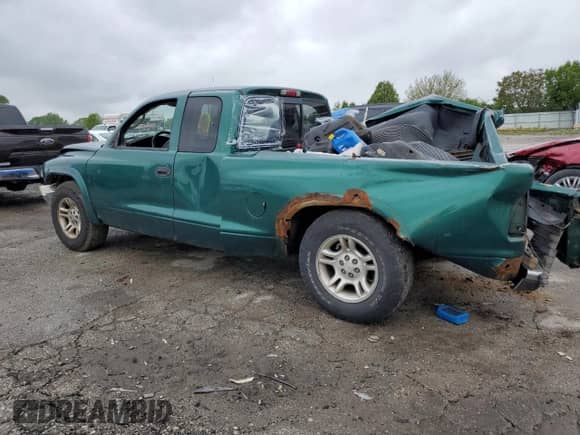 2004 Dodge Dakota SLT with VIN 1D7GL42K04S612274, listed as a Copart auction lot 57443075 with 258,513 mi miles and Salvage title. Bid and sale history available at DreamBid. Image 2.