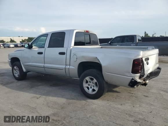 2005 Dodge Dakota SLT с VIN 1D7HE48K75S195646, выставлен на аукционе Copart как лот 63781995 с пробегом Не указан миль и Списание • Salvage title. История ставок и продаж доступна на DreamBid. Изображение 2.