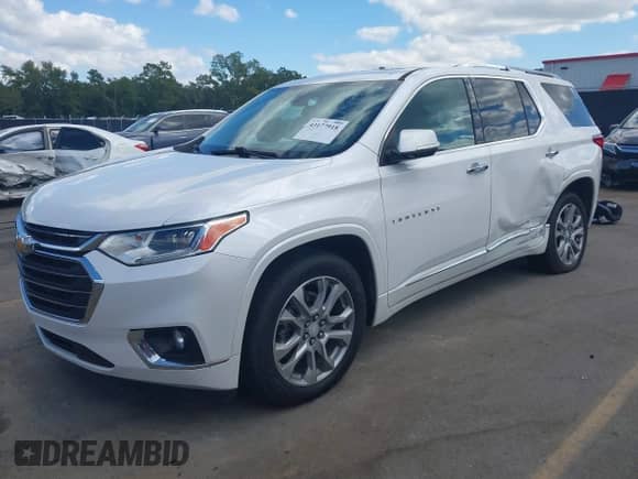 2021 Chevrolet Traverse Premier z VIN 1GNEVKKWXMJ124871, wystawiony jako IAAI lot #43177918 z przebiegiem 102 504 mil mil oraz . Historia ofert i sprzedaży dostępna na DreamBid. Obrazek 2.