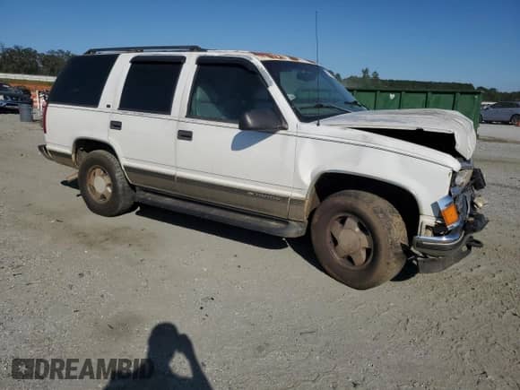 1999 Chevrolet Tahoe z VIN 1GNEK13R4XJ436751, wystawiony jako Copart lot #72084075 z przebiegiem 269 950 mil mil oraz Szkoda całkowita • Salvage title. Historia ofert i sprzedaży dostępna na DreamBid. Obrazek 4.