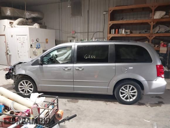 2014 Dodge Grand Caravan SXT with VIN 2C4RDGCGXER263963, listed as a IAAI auction lot 41956264 with 138,815 mi miles and . Bid and sale history available at DreamBid. Image 14.