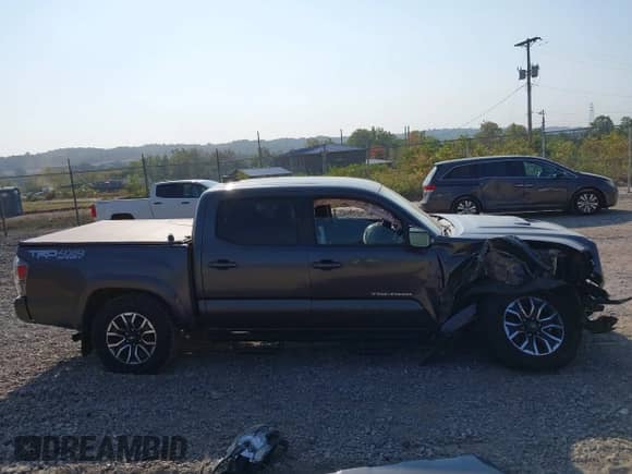 2021 Toyota Tacoma SR with VIN 3TYCZ5AN0MT027247, listed as a IAAI auction lot 43234020 with 26,058 mi miles and . Bid and sale history available at DreamBid. Image 14.