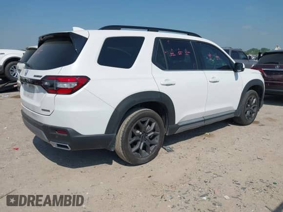 2023 Honda Pilot Touring с VIN 5FNYG2H77PB013738, выставлен на аукционе IAAI как лот 42013874 с пробегом 33 677 миль миль и . История ставок и продаж доступна на DreamBid. Изображение 4.