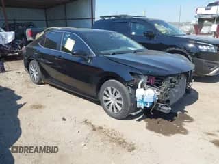 2022 Toyota Camry Hybrid LE with VIN 4T1C31AK9NU592164, listed as a IAAI auction lot 43394960 with 56,727 mi miles and . Bid and sale history available at DreamBid. Image 1.